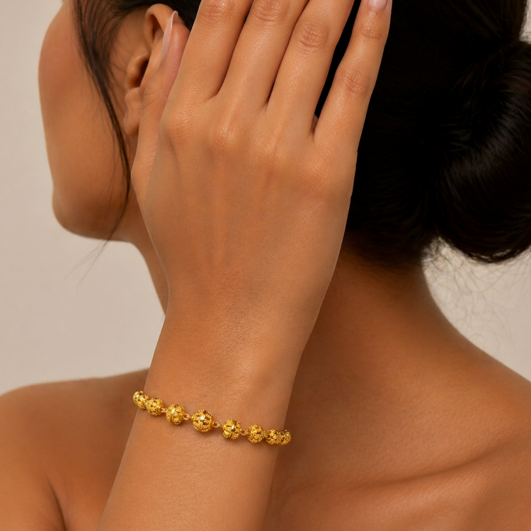 Leading wearing 22K Kolkata Gold Beaded Bracelet