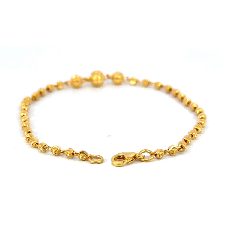 22k gold ball bracelet, 7" long.