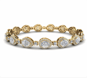 Gold and diamond bracelet set with pear shape large diamonds surrounded with a halo of smaller round diamonds