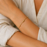 Lifestyle image of lady with Singapore 22K gold bracelet